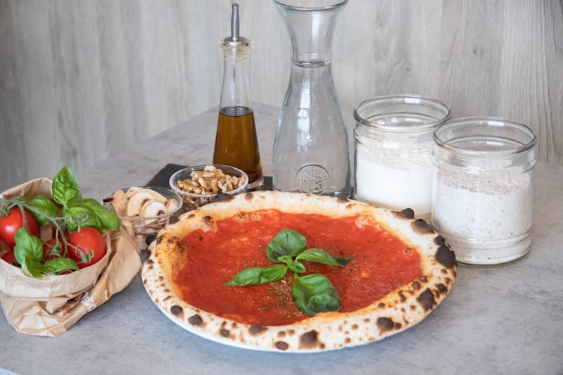 Gourmet burger with fresh toppings available at Dewey's pizza restaurant